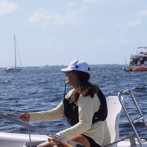 A sailing instructor at the helm on Biscayne Bay