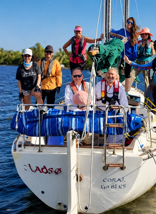 A class crew in life jackets aboard the sailboat Coral Gables