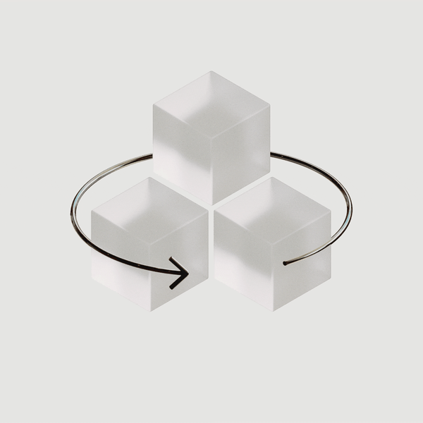 3D representation of discovery track, glass cubes and a metal arrow that spins around them.