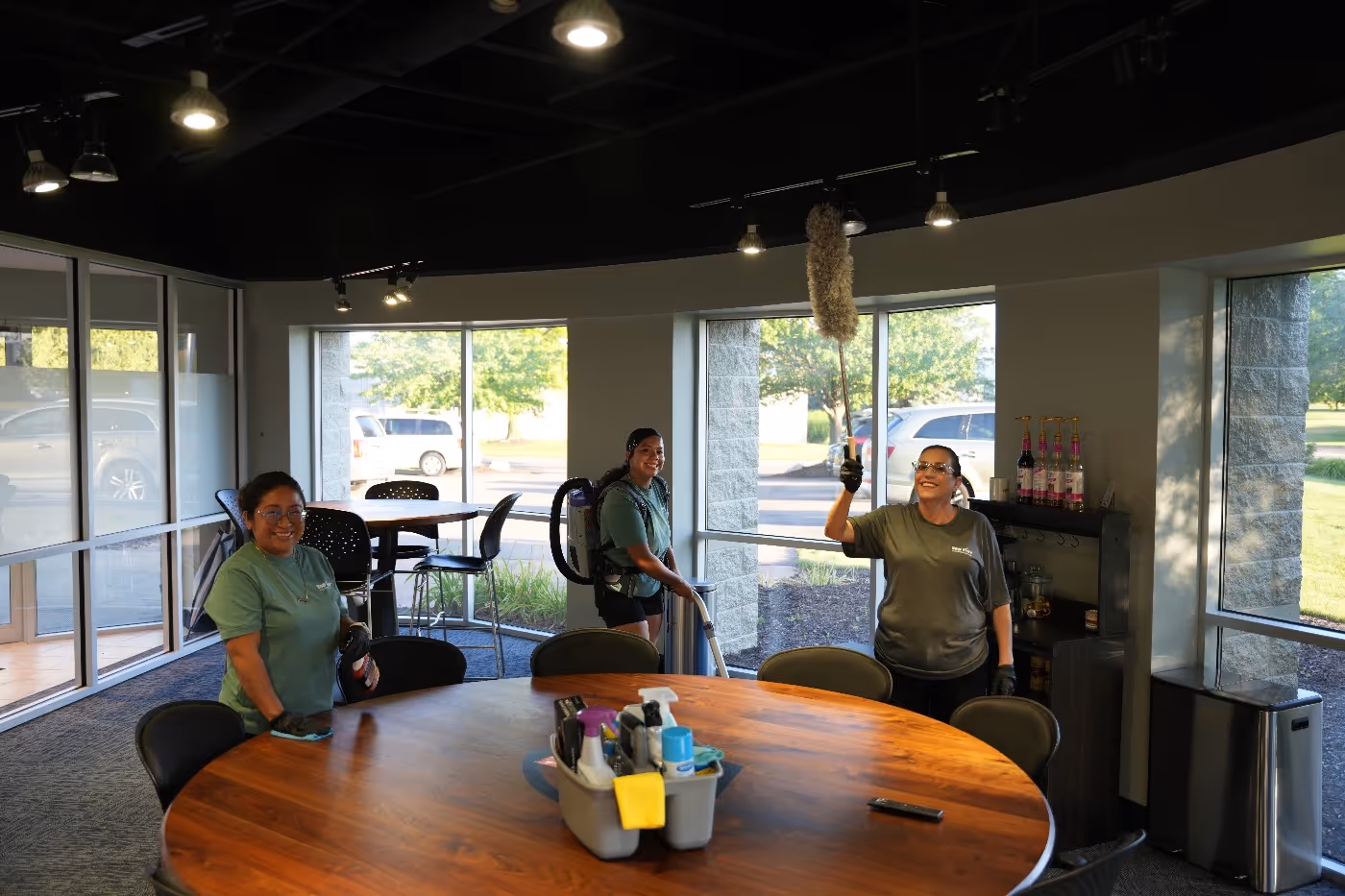 Top Tier Environmental Service workers performing a commercial cleaning service in office space