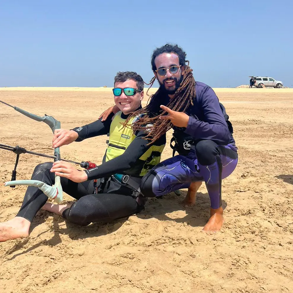 Kitesurf student and instructor enjoying a training session.
