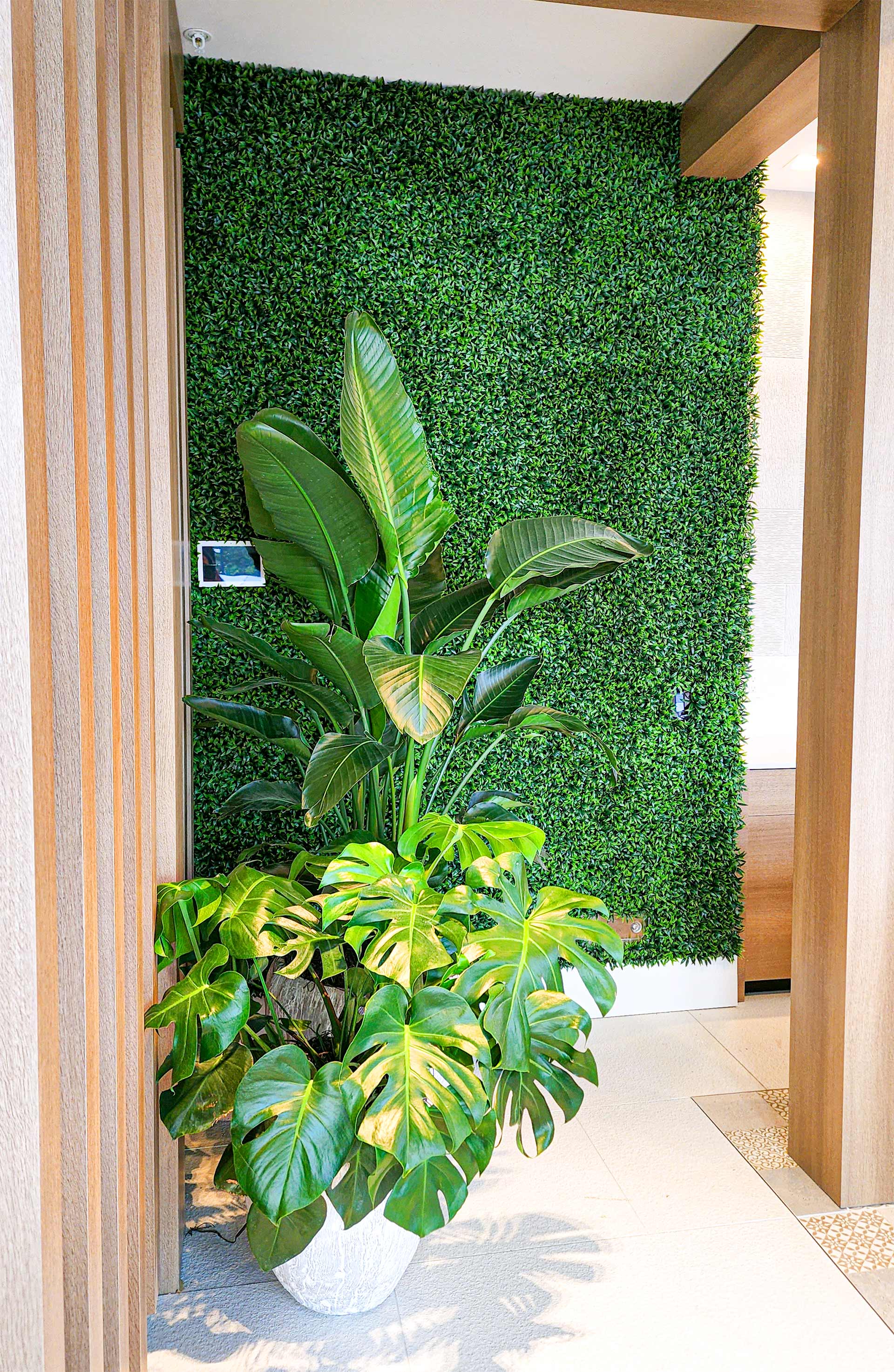 Wall of artificial plants from floor to celing