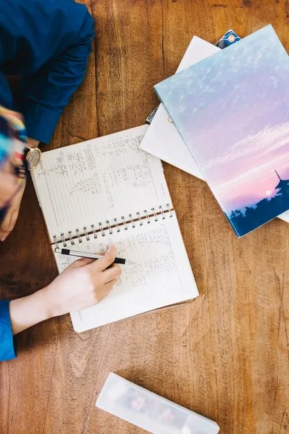 Free Photo crop person fulfilling exercise in classroom