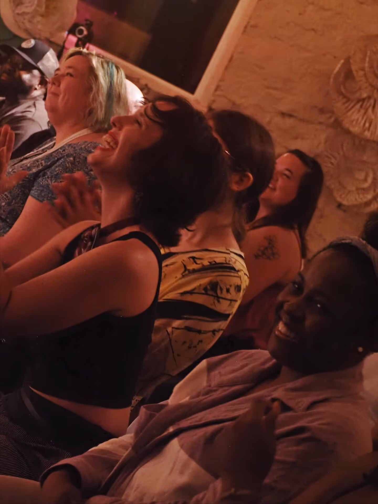 Audience laughing and clapping at Secret Aisle show.
