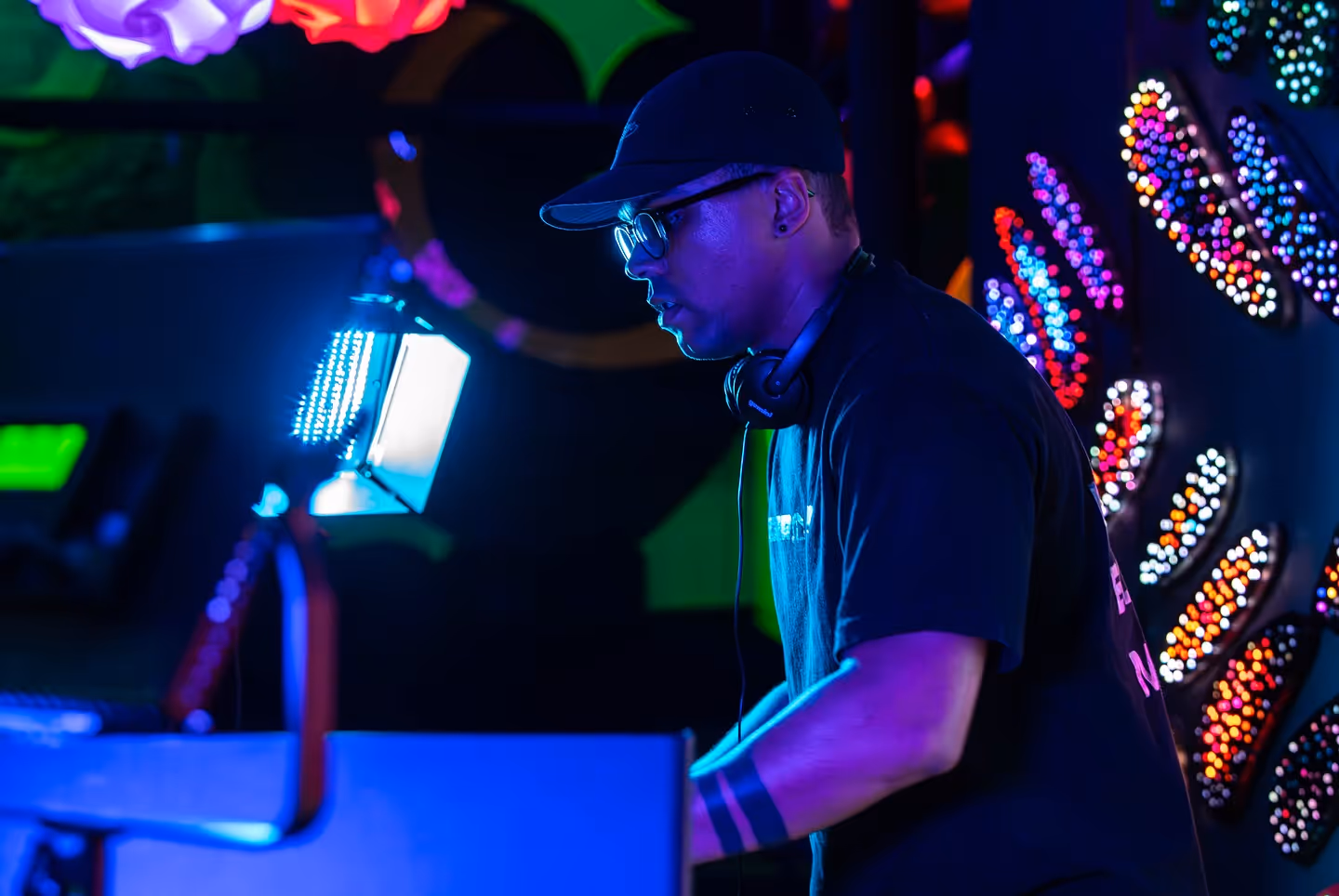 ATL Sync DJ at booth, blue glow and LEDs