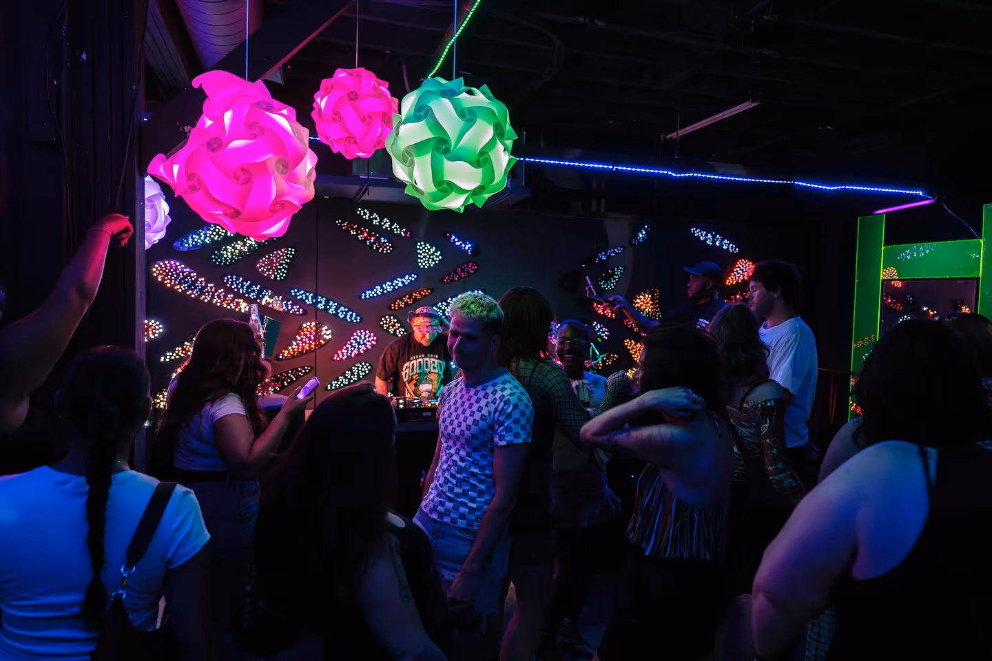 ATL Sync crowd dancing under neon LED art