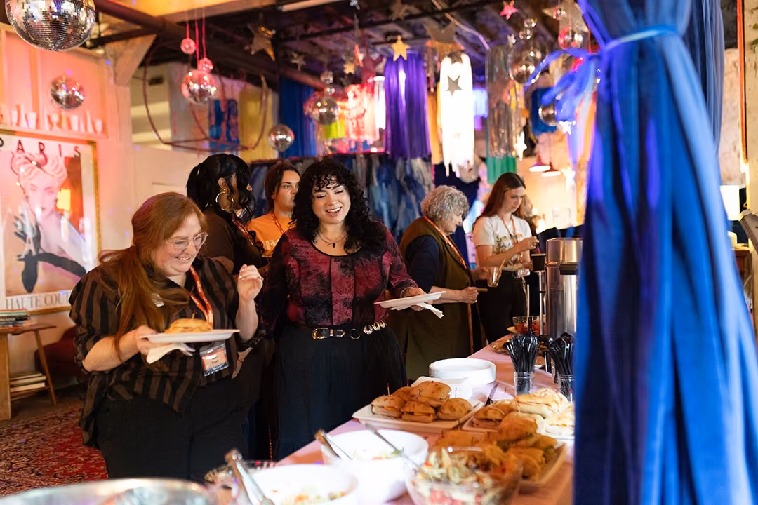 A relaxed, well-lit gallery space during a daytime event.