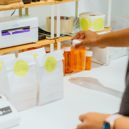 doctor filling a prescription for a patient