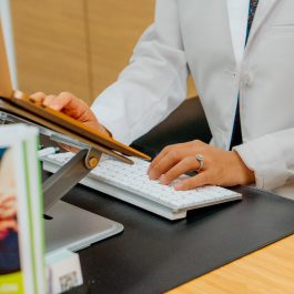 doctor typing on the computer