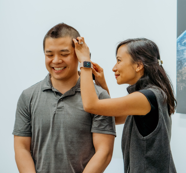 doctor looking into patient's ear