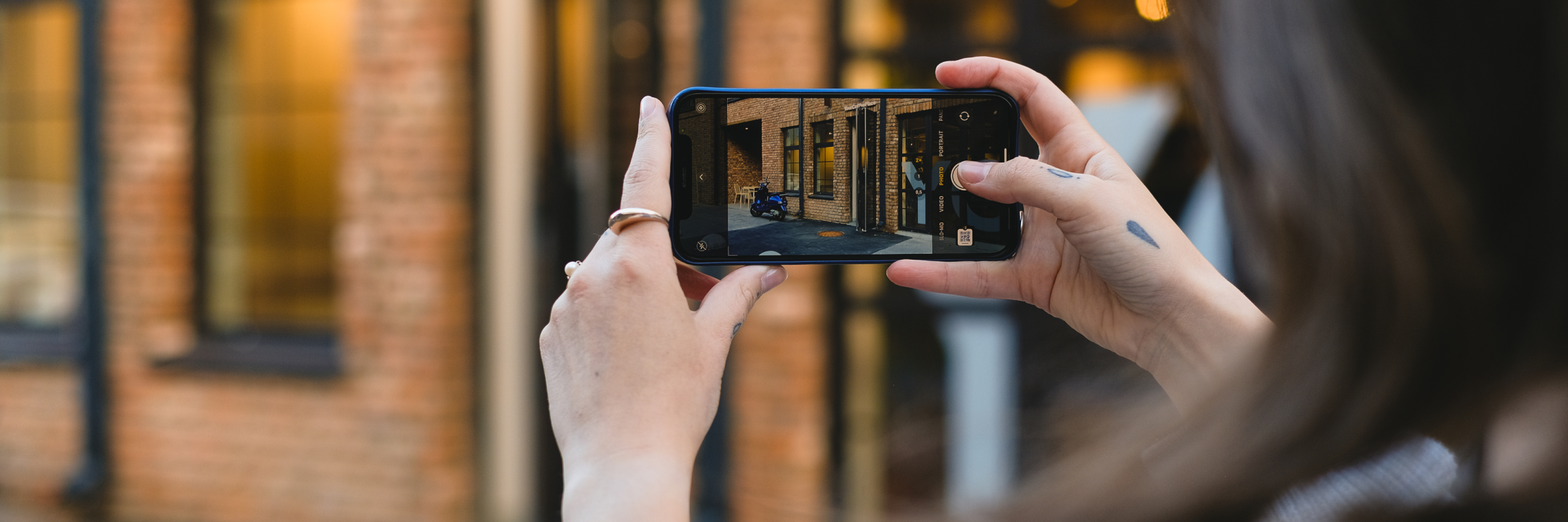 Someone taking a photo a business for a virtual site inspection