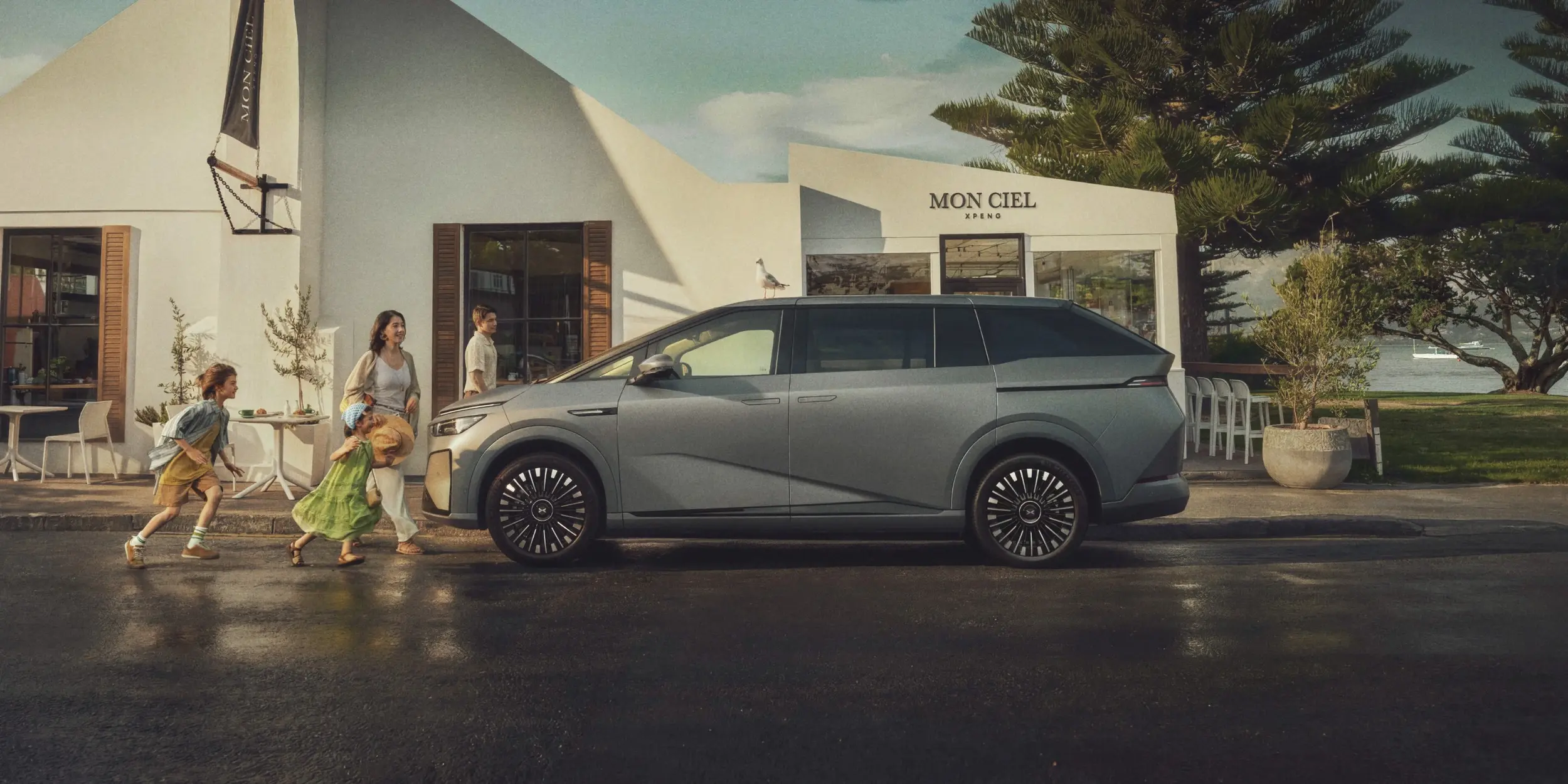 A family walking towards their XPENG X9 EV
