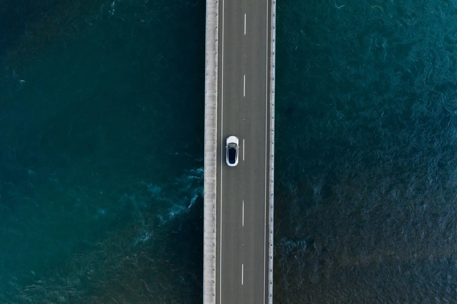 Tesla Model 3 EV driving in New Zealand