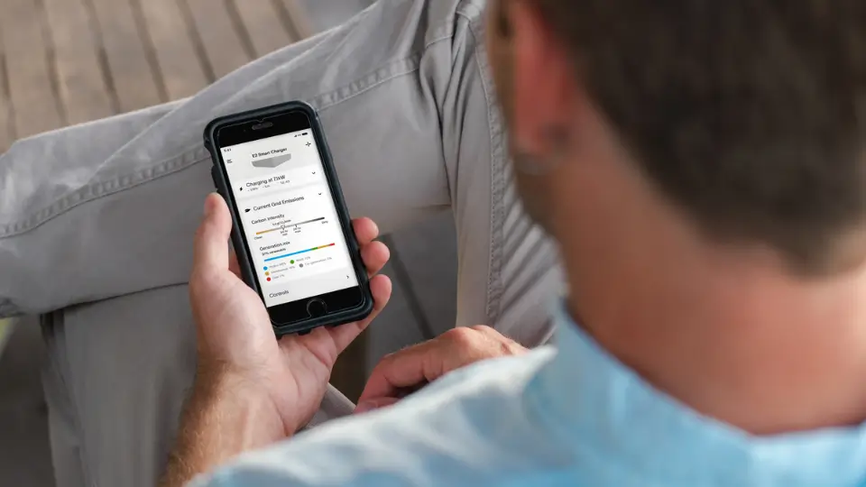Person looking at the Evnex app on phone