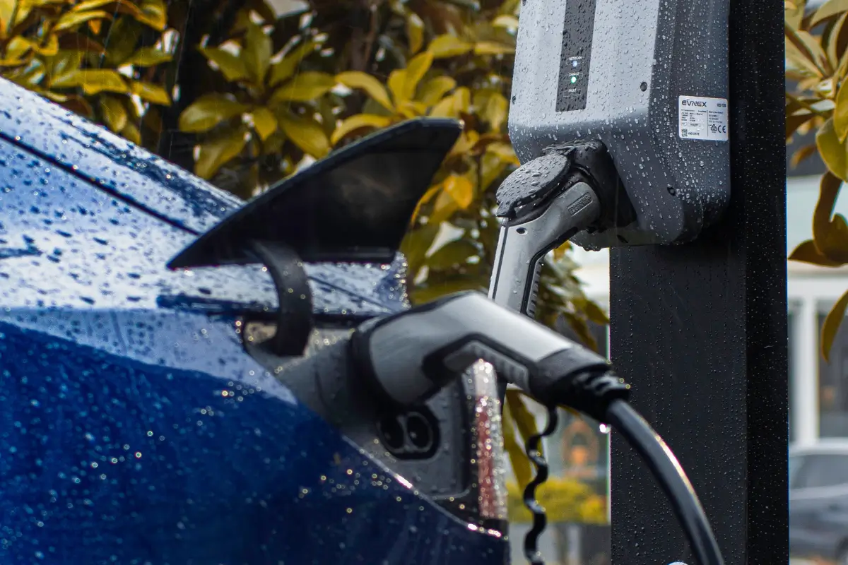Charging a Tesla in the rain with an Evnex X22 EV charger