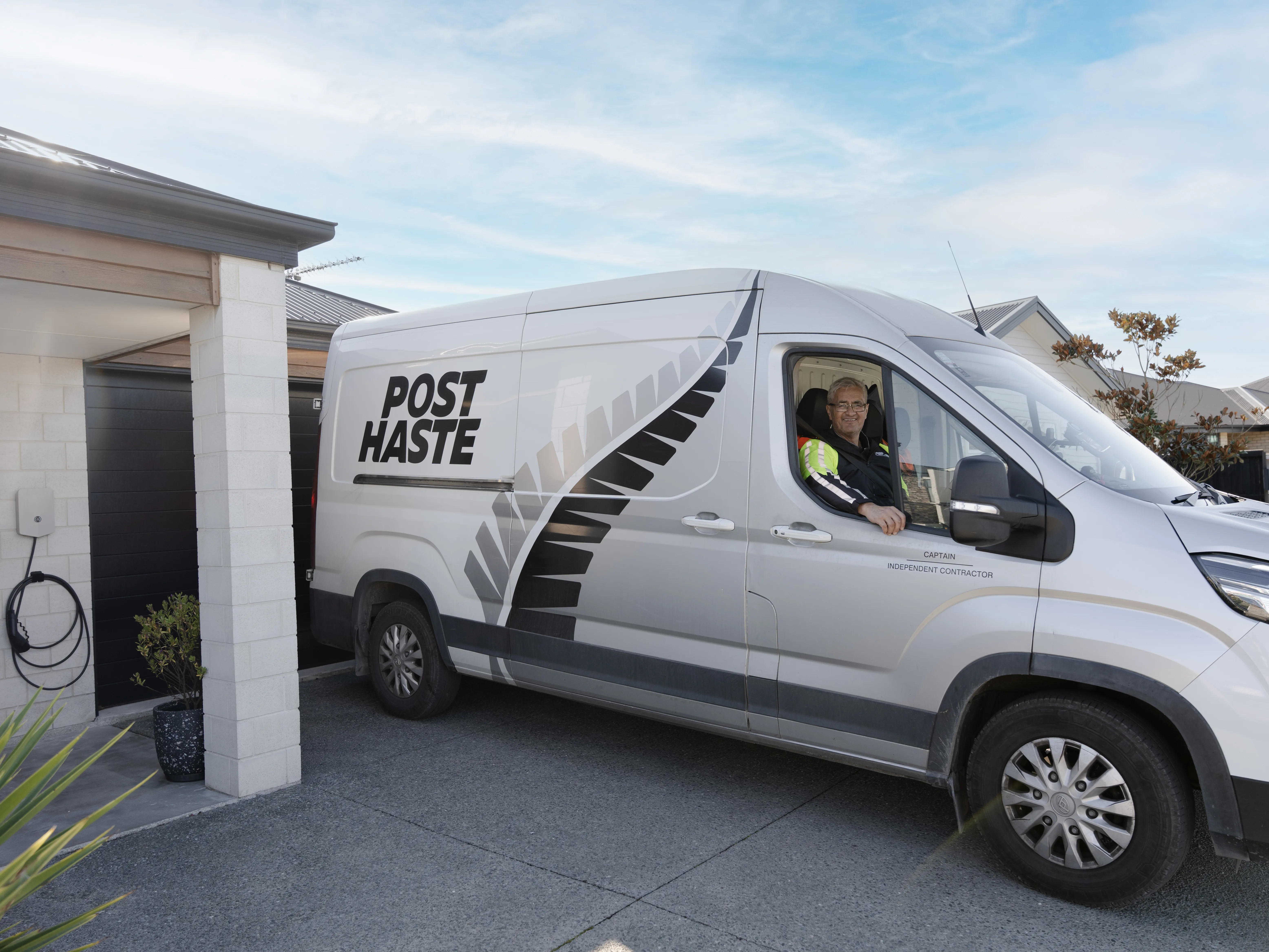 Courier driver with electric van and Evnex charger
