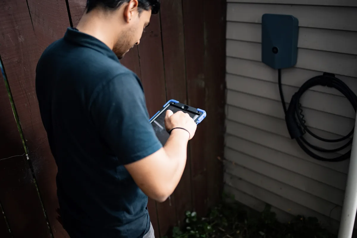 Installer commissioning an Evnex E2 charger