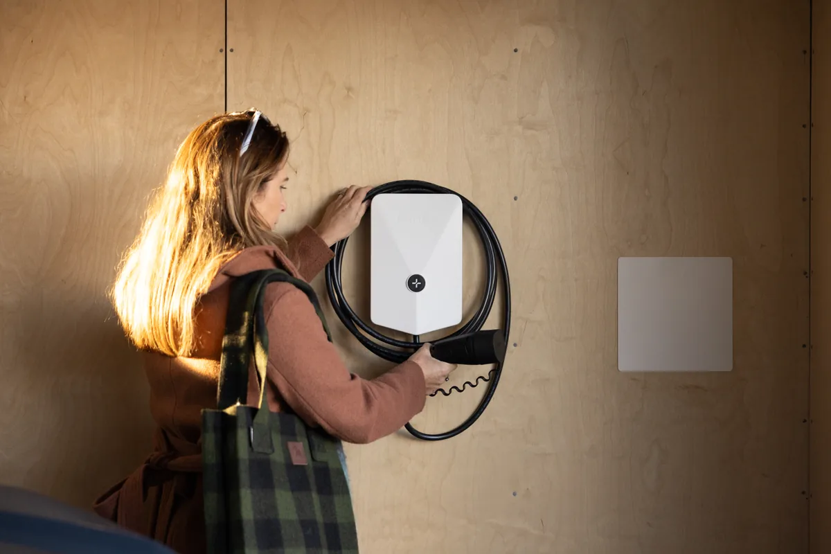 women with a Snow Evnex E2 Plus smart home EV charger