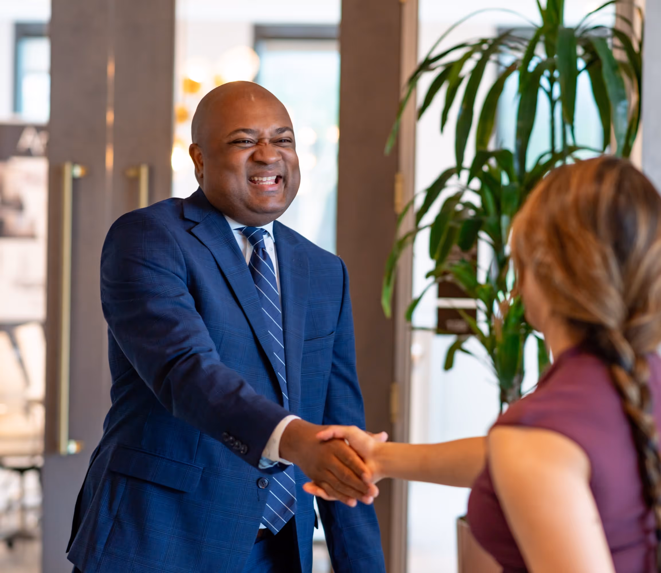 Man shaking women's hand