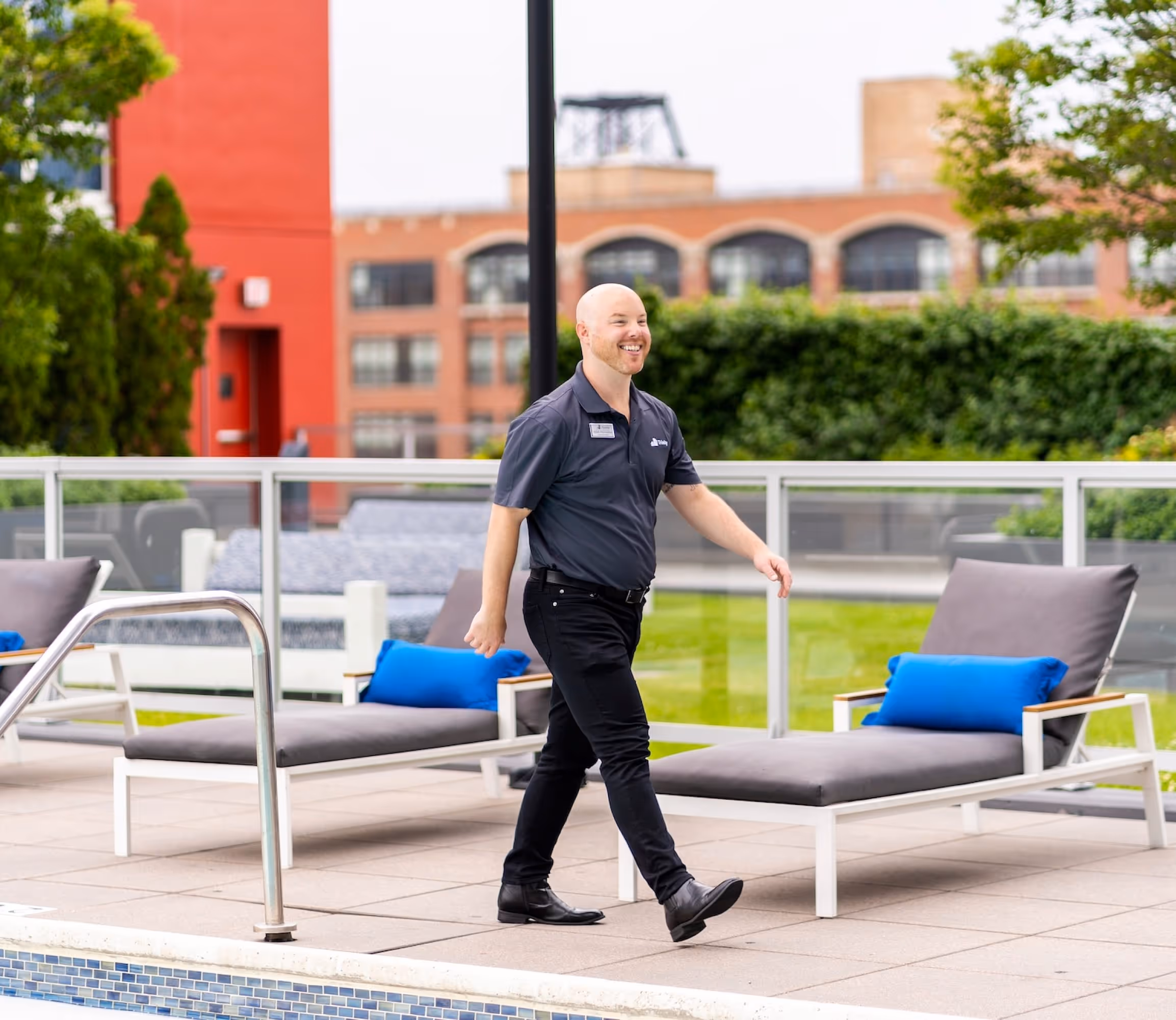 Employee walking by pool