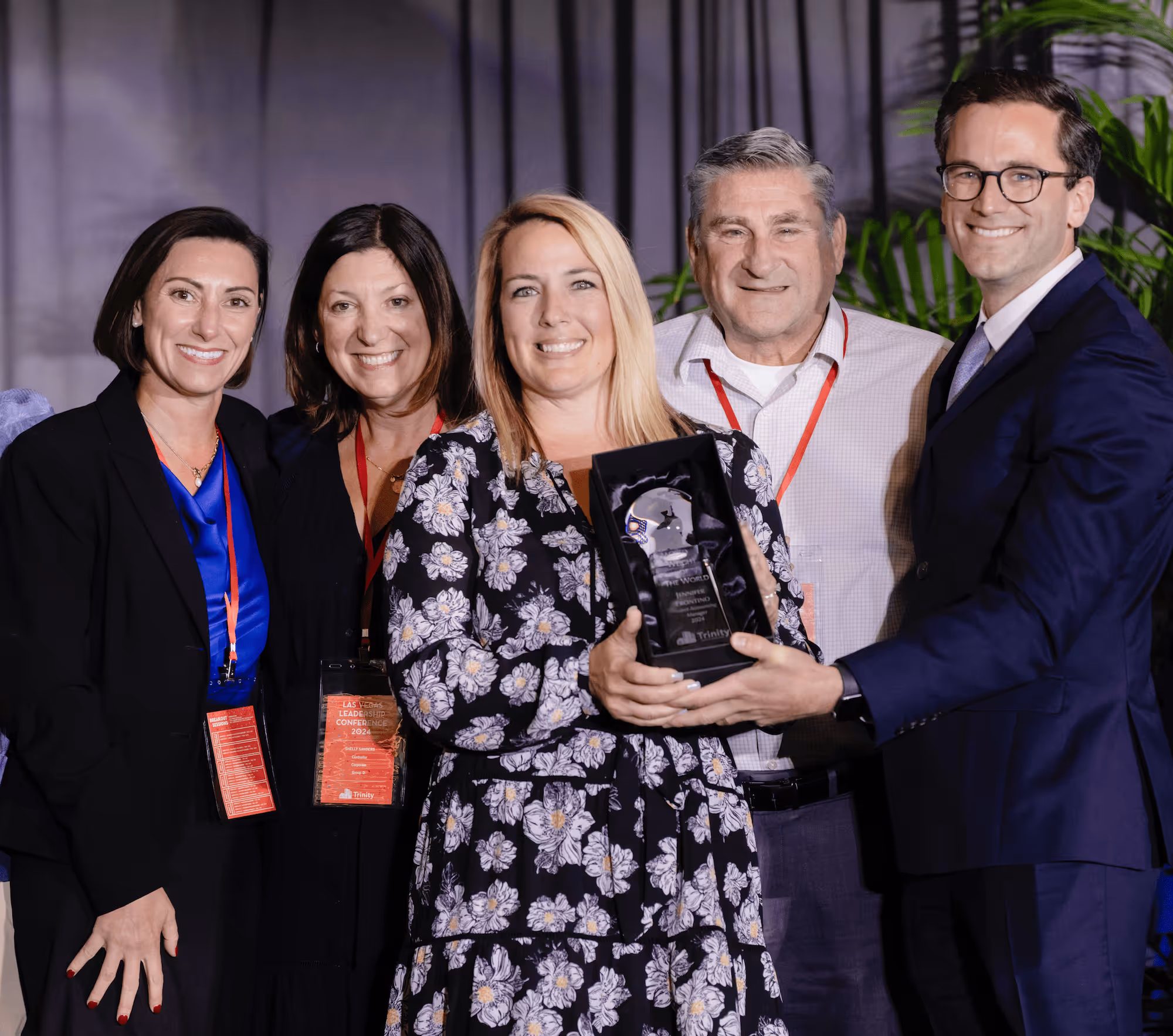 Group photo holding award