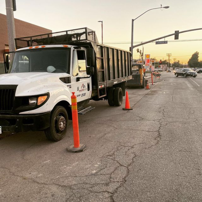 A parked truck on the side of the road.