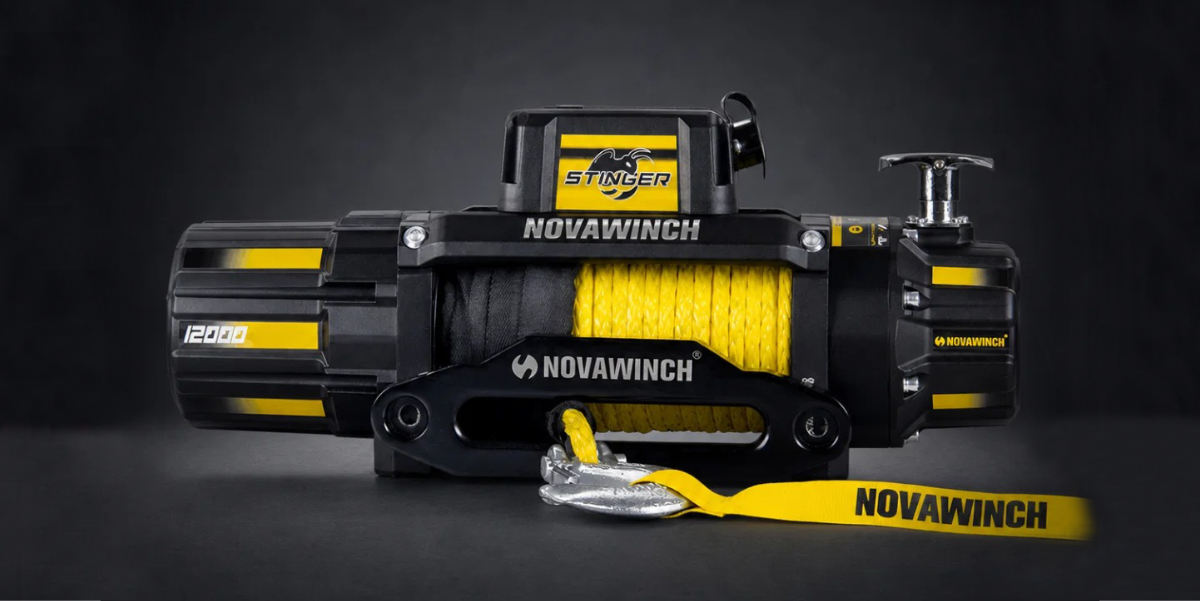 Yellow racing truck with logos driving on a track beside the text 'SOLID X POWER PERFORMANCE PRECISION' on a black background.
