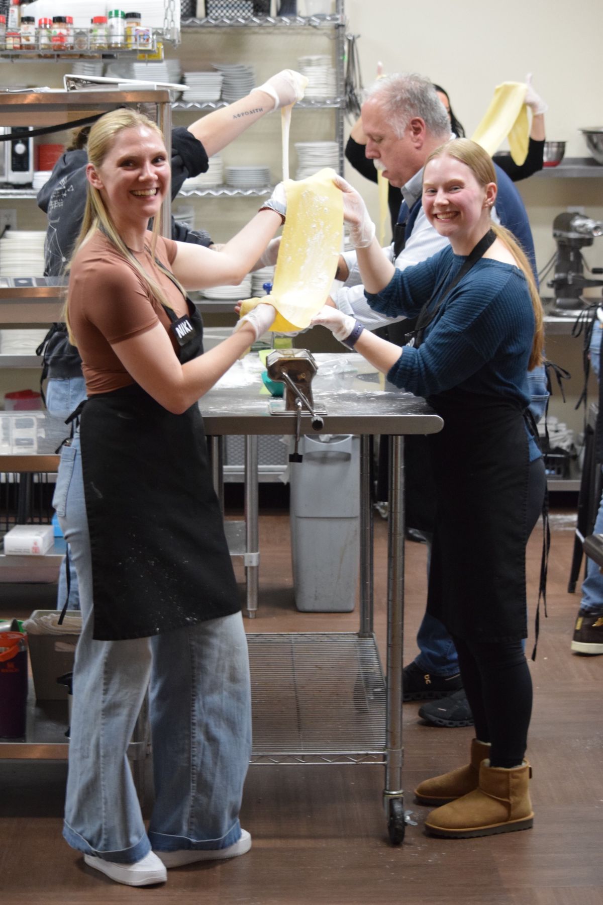 Guests roll fresh pasta in a class at Chef Pam's Kitchen