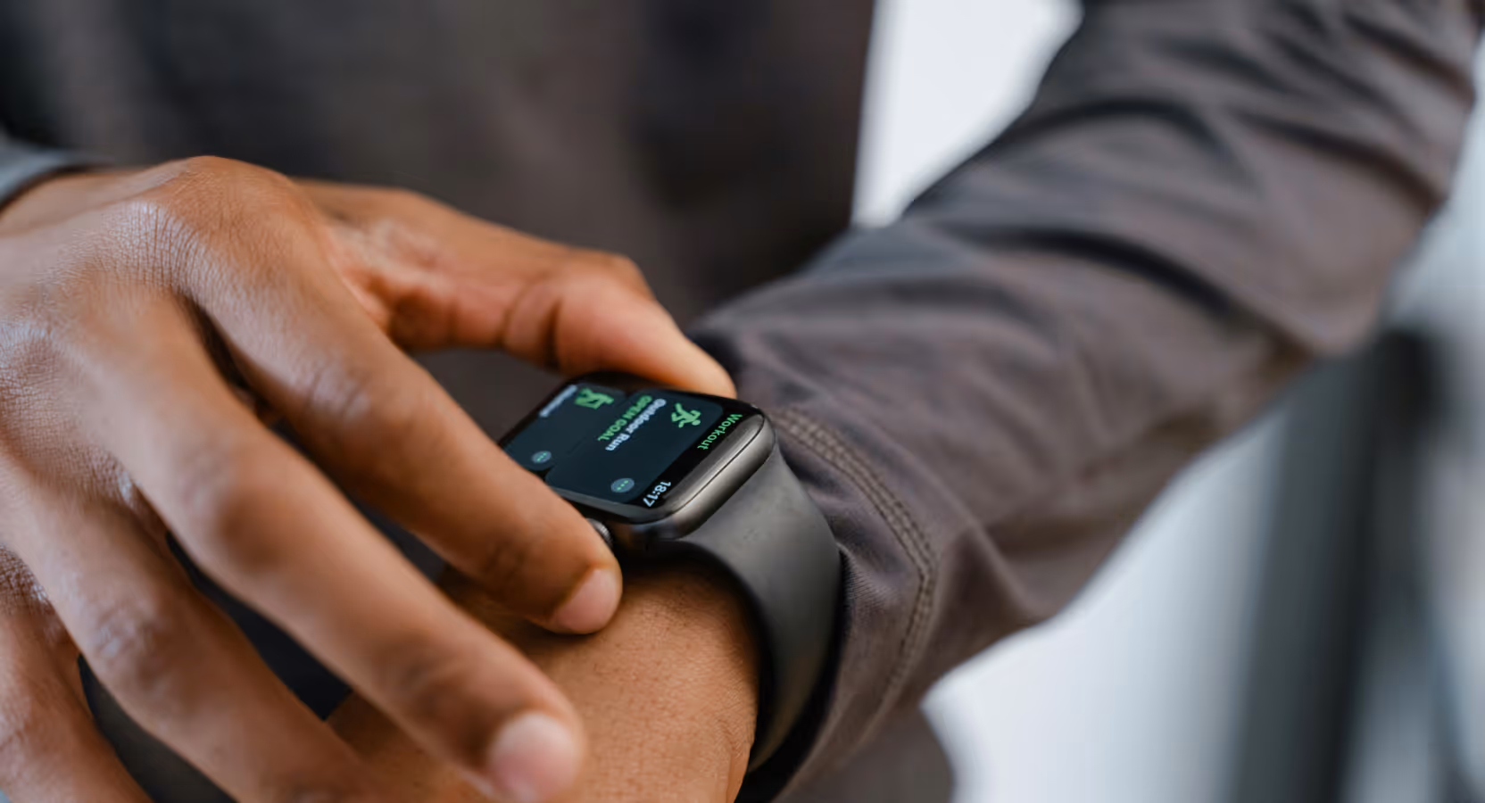 User interacting with a fitness tracking app on a smartwatch, representing customer-centric product development focused on personalized digital health solutions. Example of Momentum’s approach to building HealthTech products aligned with real user needs.