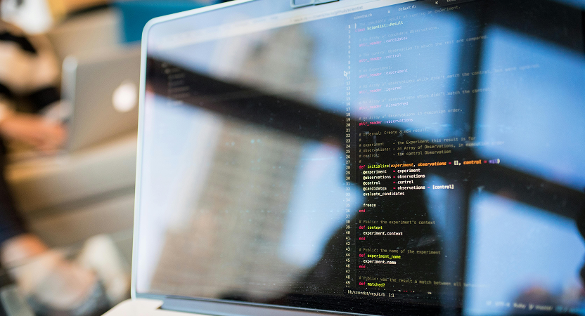 Laptop screen displaying healthcare AI programming code during development process