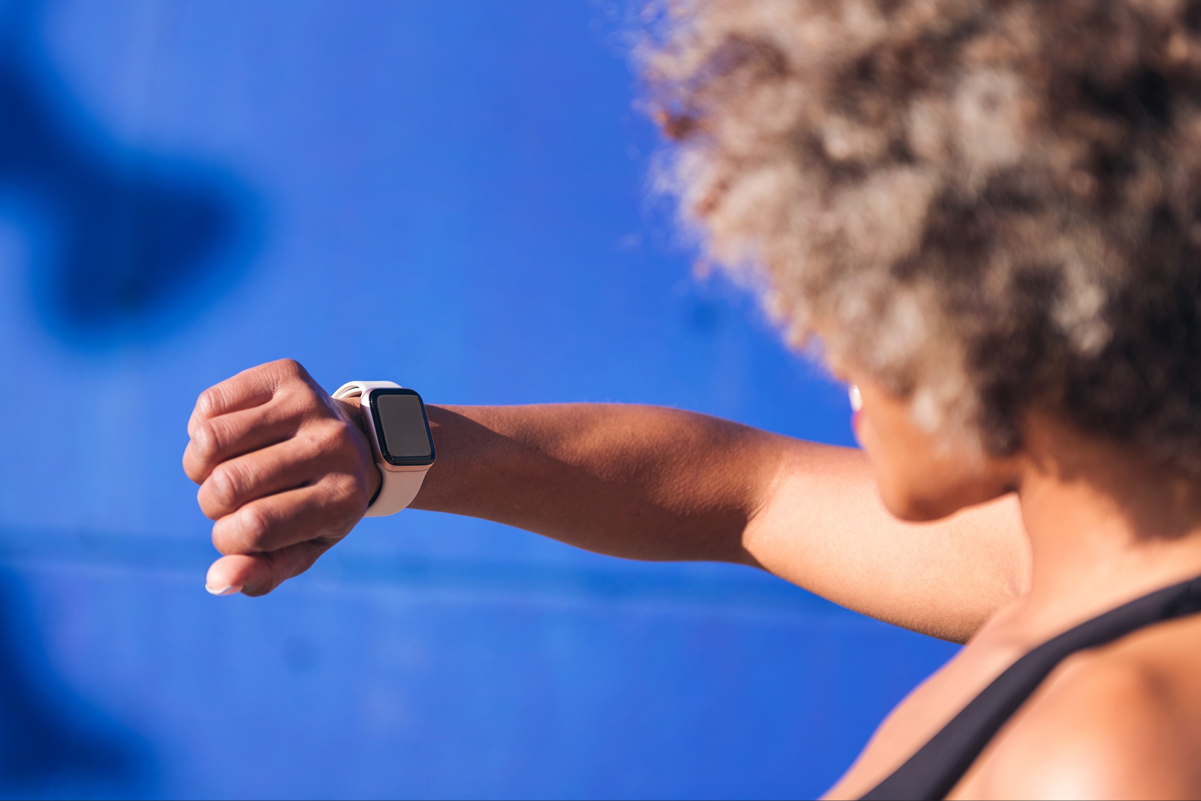 Woman checking a smartwatch on her wrist