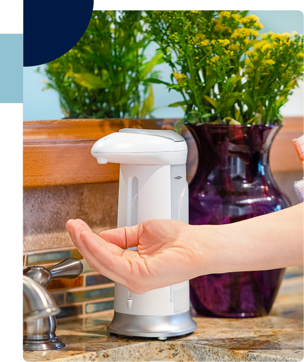 Person washing their hands with Emson product