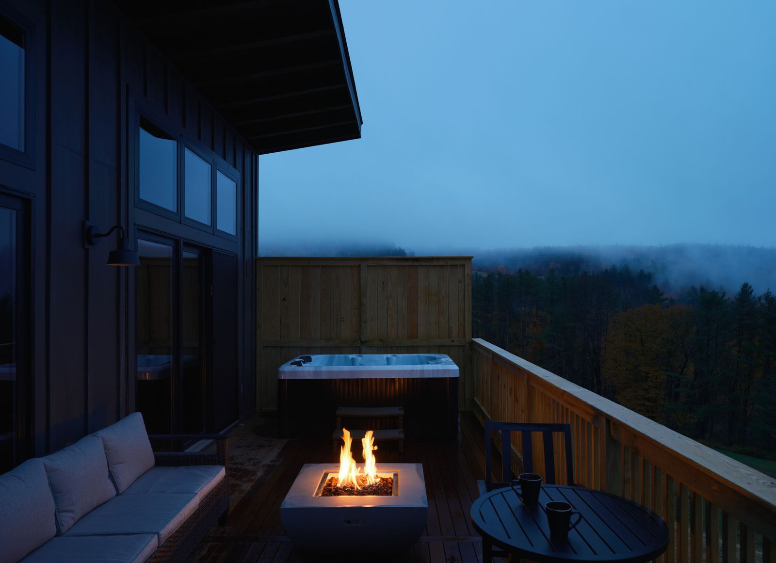 Private hot tub, deck seating, and mountain view at Hinata