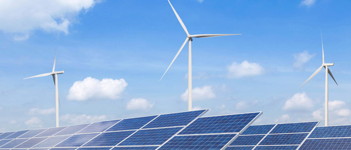 Image of a solar panels and wind turbines
