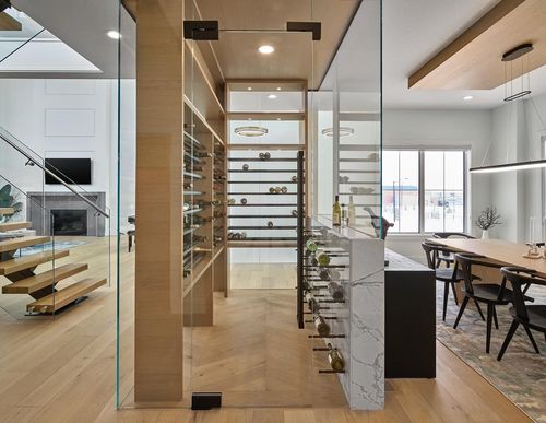 custom glass wine bottle room in large modern home
