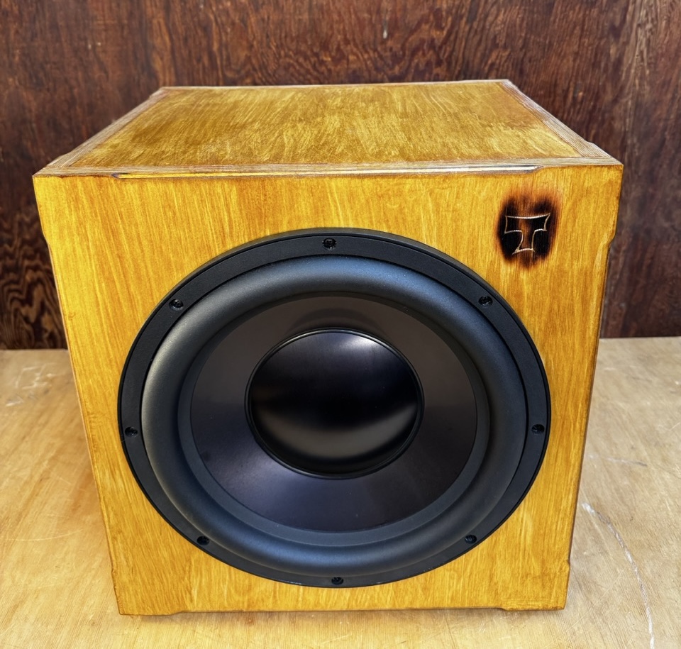 Atomic Subwoofer top view of Baltic Birch construction with view of carved tiki "T" logo handmade by Tiki Tube Amps
