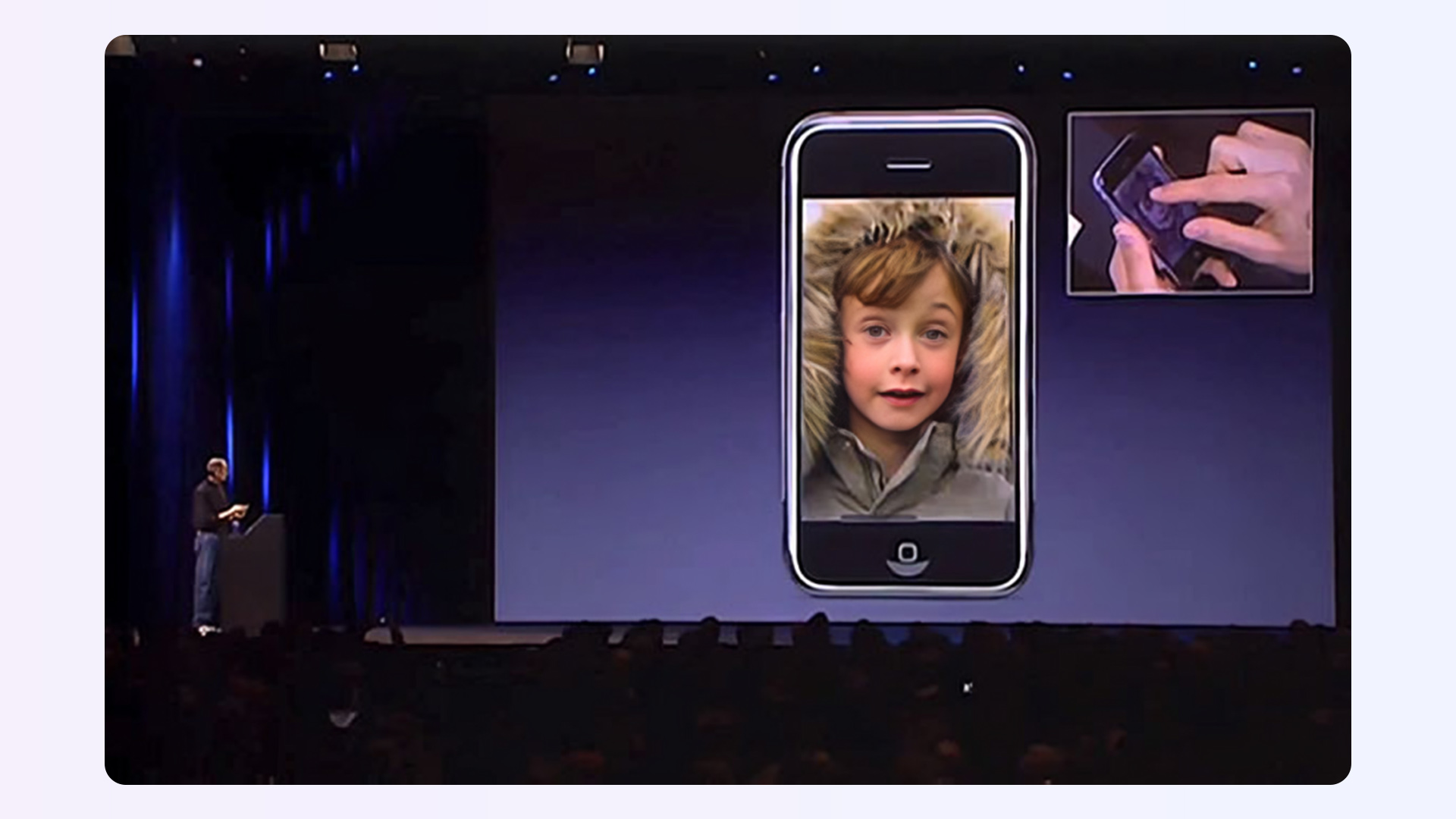 Steve Jobs demonstrating iPhone pinch-to-zoom feature showing the outcome not the technology