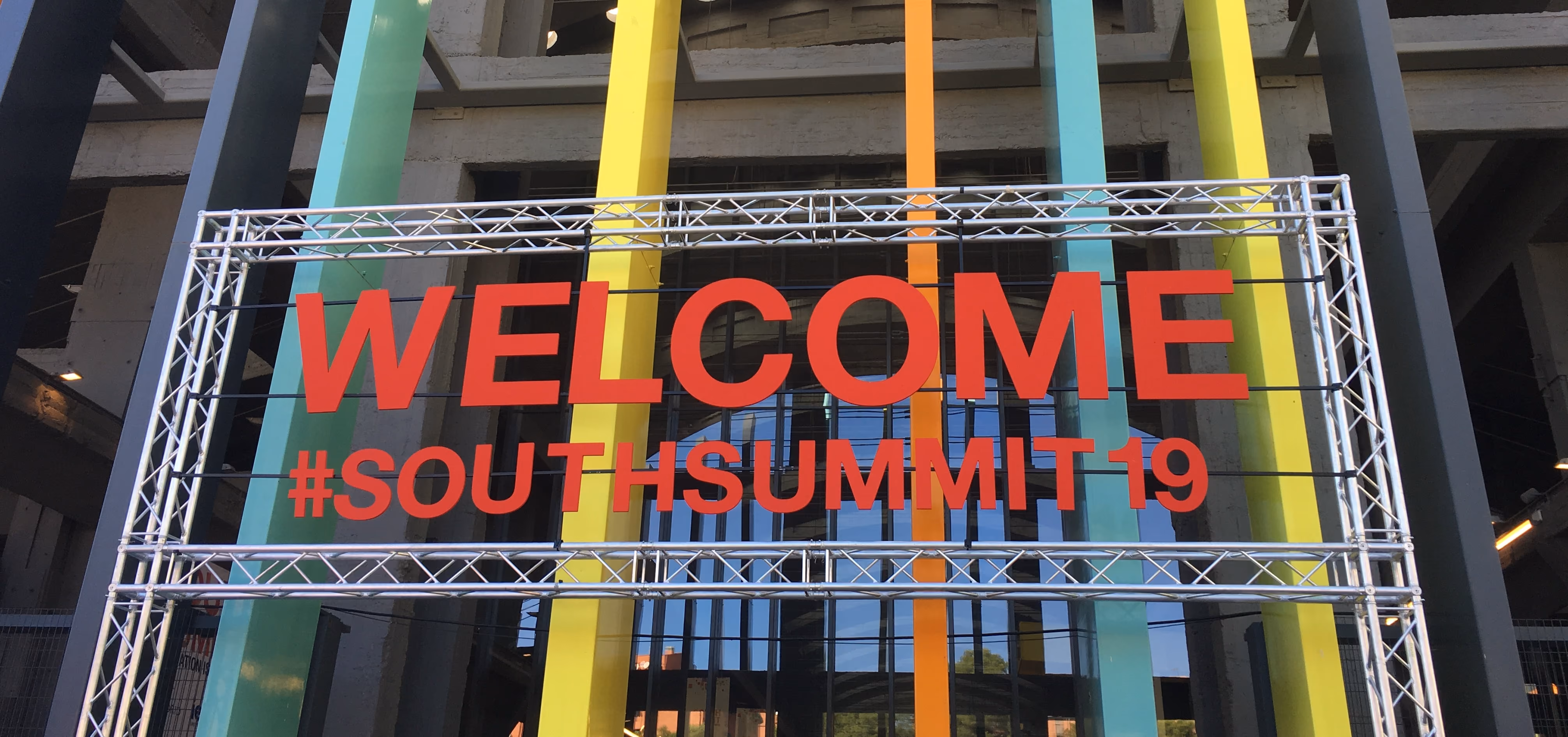 Colourful welcome sign for South Summit 19 in metal structure