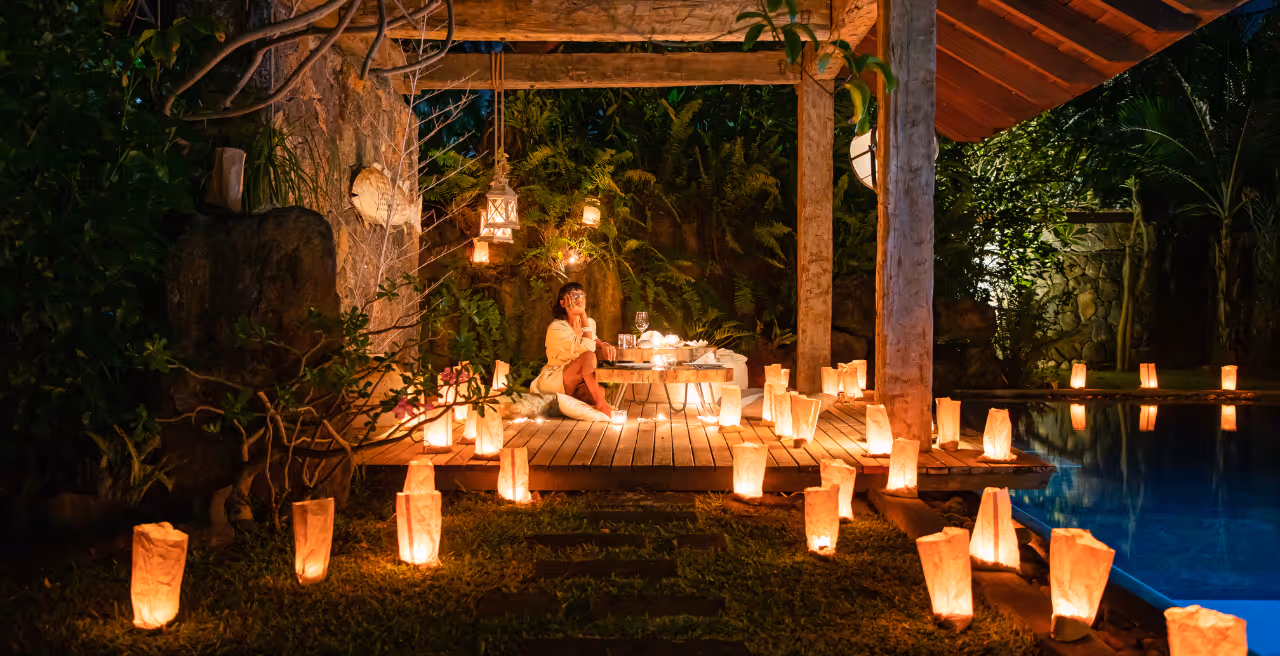 Family enjoying a festive Christmas celebration at a luxurious beachfront villa in Mauritius, surrounded by tropical holiday decorations.