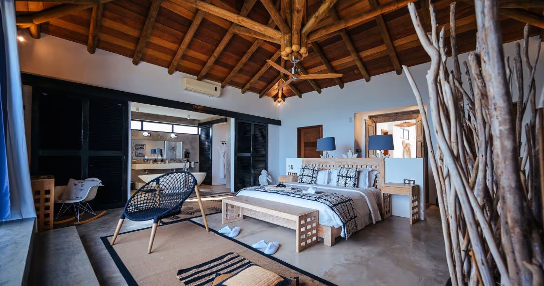 A stunning luxury villa in Mauritius with a private infinity pool, beachfront views, and lush surroundings, perfect for an exclusive retreat.