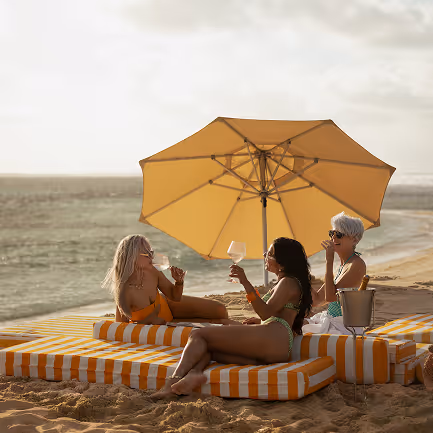 Happy guest served breakfast by the Muse Villa team