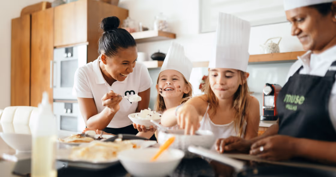 Kids having fun with the hotel staff members