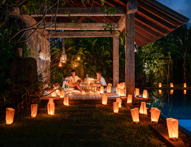 Luxury Christmas with muse villas: festive villa décor, private pool, and oceanfront tropical scenery.