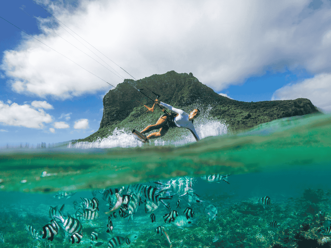 Kitesurfing session at sunset in Belle Mare lagoon, on the east coast of Mauritius