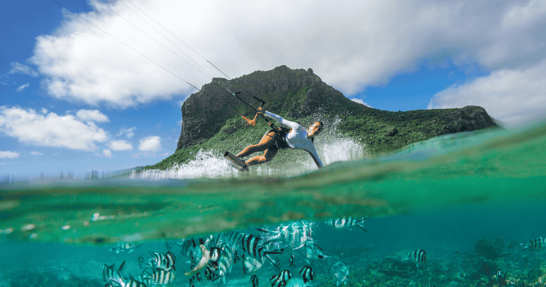 Kitesurfing session at sunset in Belle Mare lagoon, on the east coast of Mauritius