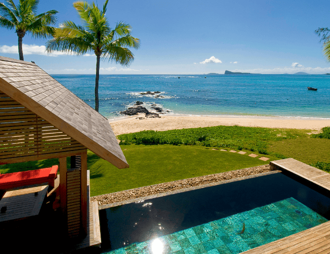 Luxury seaside property with infinity pool overlooking sandy beach and turquoise sea