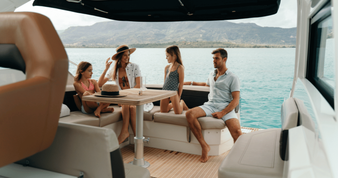 A multi-generational family relaxes on a private yacht, embracing the slow living lifestyle in tropical Mauritius.