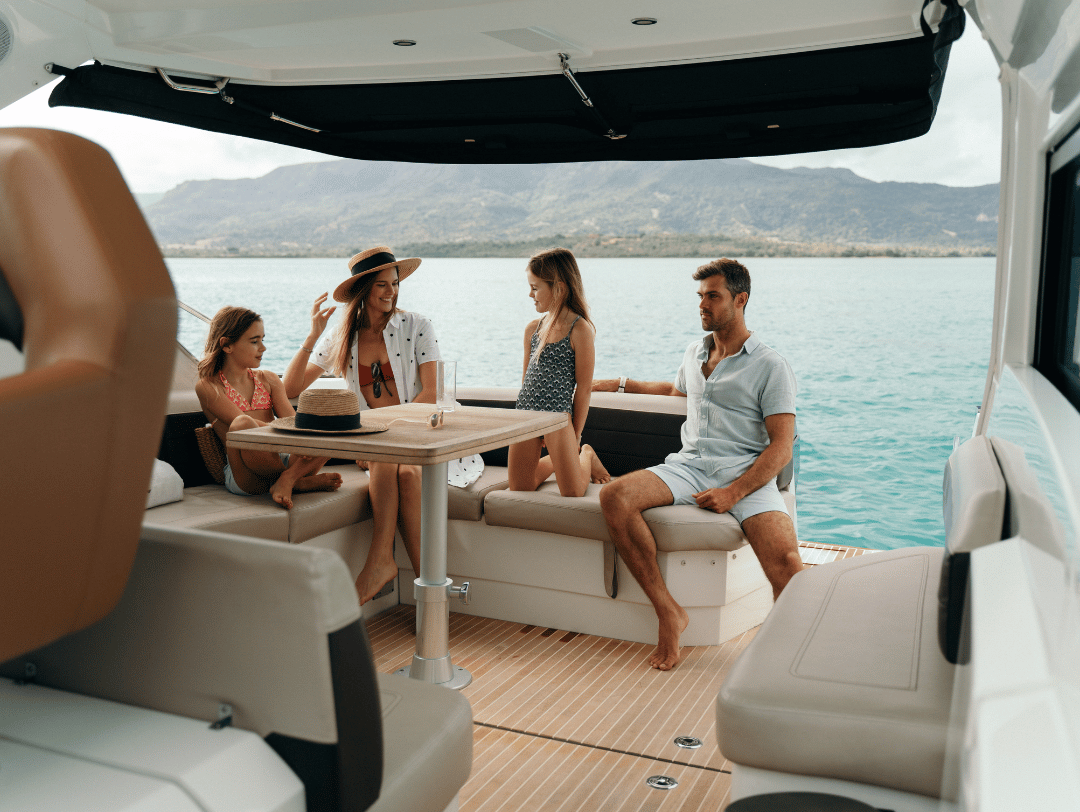 A multi-generational family relaxes on a private yacht, embracing the slow living lifestyle in tropical Mauritius.