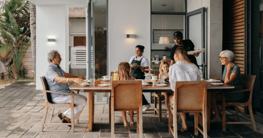 Family of multiple generations having a gourmet breakfast at a luxury holiday villa by Muse Villas.