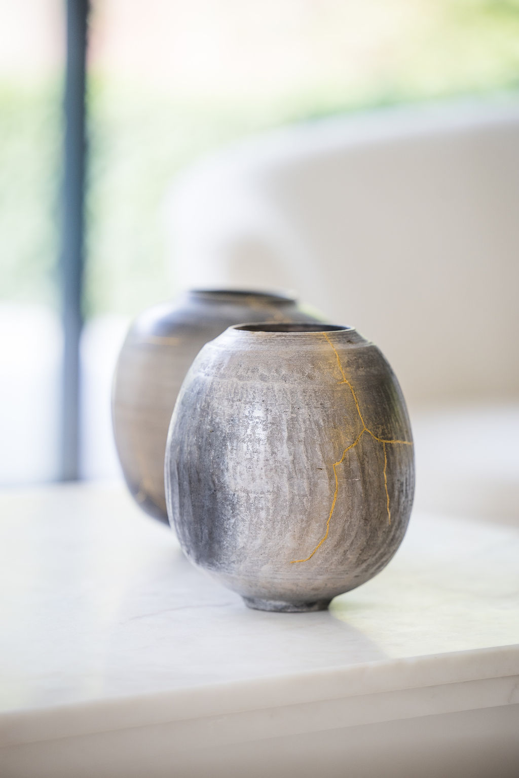 Karen Swami Ceramic Art – Touareg Series – Wheelthrown Stoneware, Smoke Fired, One of a Kind. Explore the exquisite craftsmanship of Karen Swami ceramics, where the mastery of matter, oxides, and flames comes together to create unique works of art. Specializing in sandstone and earthenware, Karen Swami pushes the boundaries of traditional pottery techniques, refining shapes and enhancing colors to create contemporary ceramic art that is both fragile and powerful. Inspired by the timeless beauty of Etruscan vases, Karen Swami’s work reinterprets ancient forms with sumptuous curves and modern contemporary lines, making each piece a stunning decorative addition to any space. The Touareg series features wheelthrown stoneware, expertly smoke fired to bring out rich textures and tones, resulting in one-of-a-kind ceramic pieces. Crafted for decorative purposes only, Karen Swami’s ceramic art pieces are more than just functional—they are true works of art, perfect for collectors and lovers of unique handmade pottery. Elevate your home or collection with the beauty of Karen Swami's smoke-fired ceramics today.